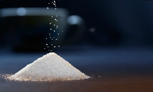 This popular white crystalline sweetener commonly called table sugar is a type of carbohydrate called sucrose. It is mainly processed from the stems of sugarcane and from the roots of sugar beet.