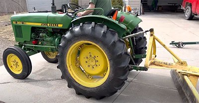 how much does a john deere 650 tractor weight