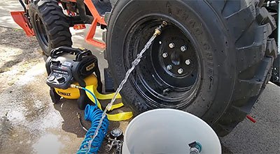 how to put liquid ballast in tractor tires
