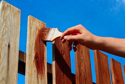 how to properly maintain a wood fence