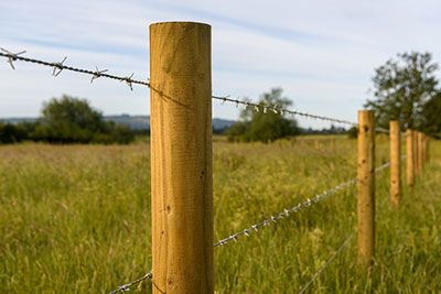 why do farmers put rocks on fence posts