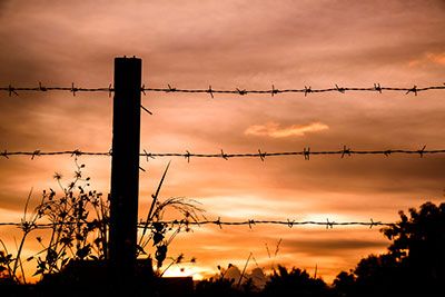 how to install barb wire fence